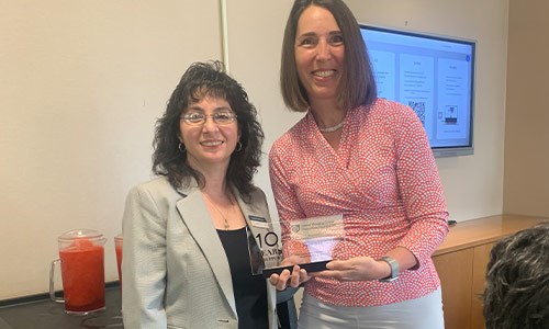 Sunnyside Federal President and COO, Gerardina Mirtuono, receiving a ten year recognition award from the Senior Housing Crime Prevention Foundation.